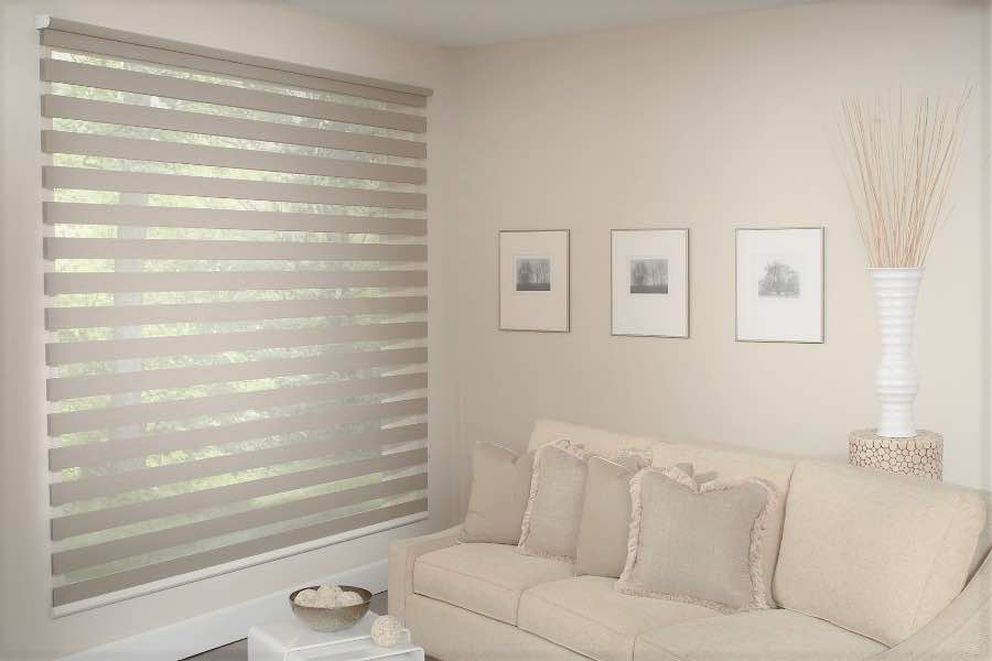 Zebra shades give you a unique combination of light control and style that benefits your Houston home. Zebra shade allows filtered light into a living room