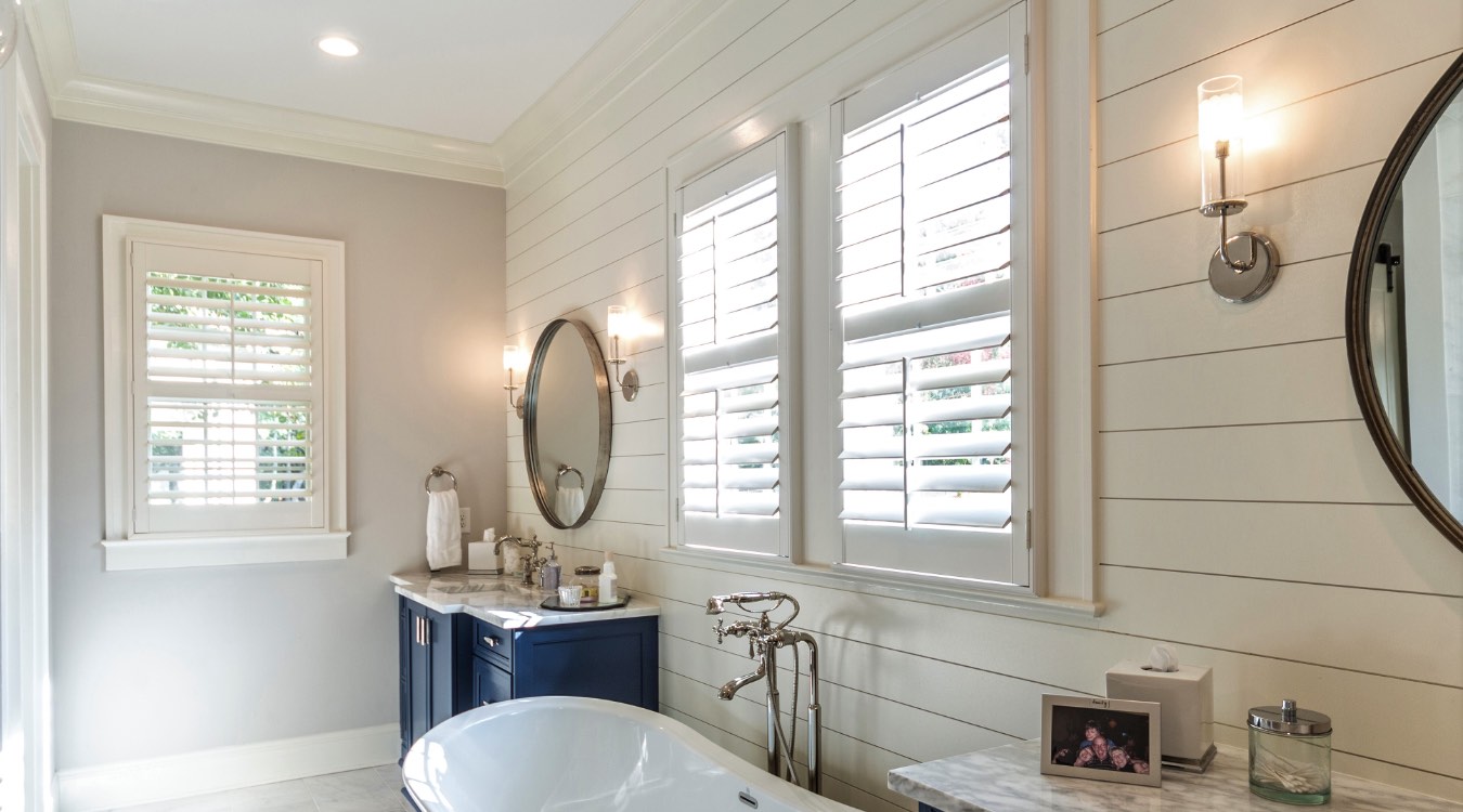 Houston bathroom with white plantation shutters.