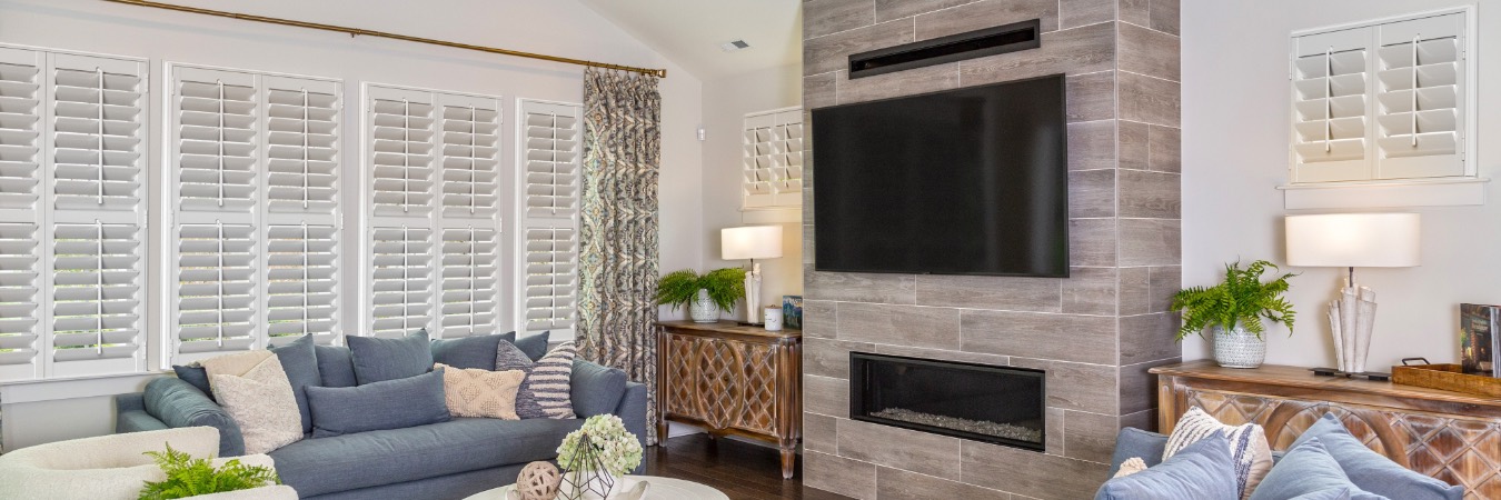 Interior shutters in Pasadena family room with fireplace