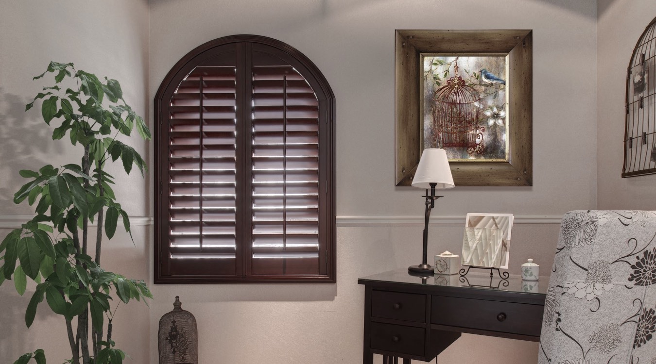 Arched ovation shutters in bedroom