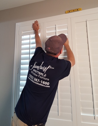 Shutter installation in Houston bedroom.