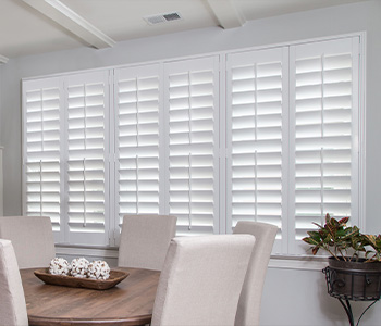 White Polywood shutters in a dining room