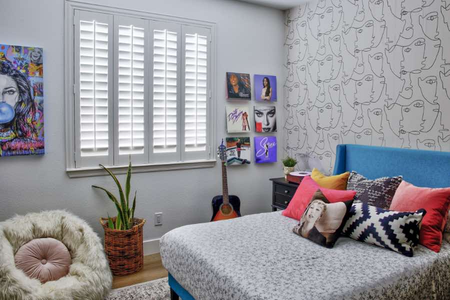 Offering the ultimate in light management, interior window shutters are suitable for all spaces, including bedrooms. Polywood interior window shutter allowing light into bedroom