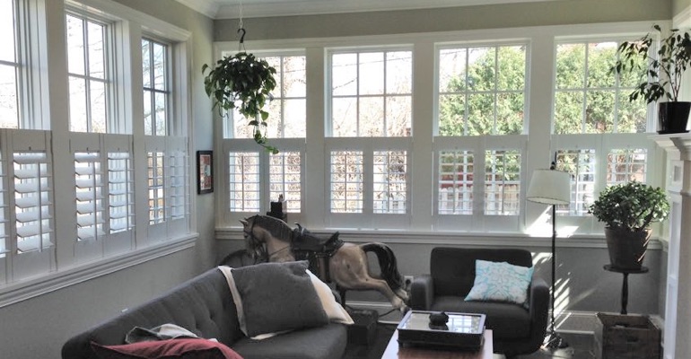 Cafe shutters in a living room in Houston. Houston cafe shutters sun room