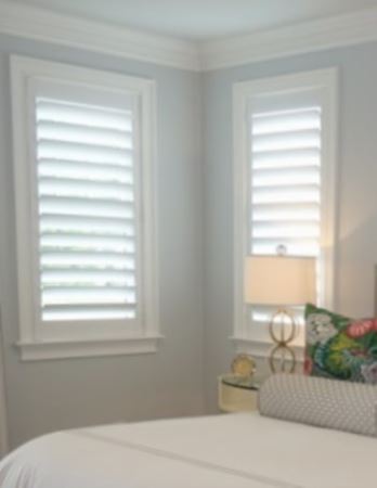 Hidden tilt rod shutters open. White plantation shutters with hidden tilt rods in Houston