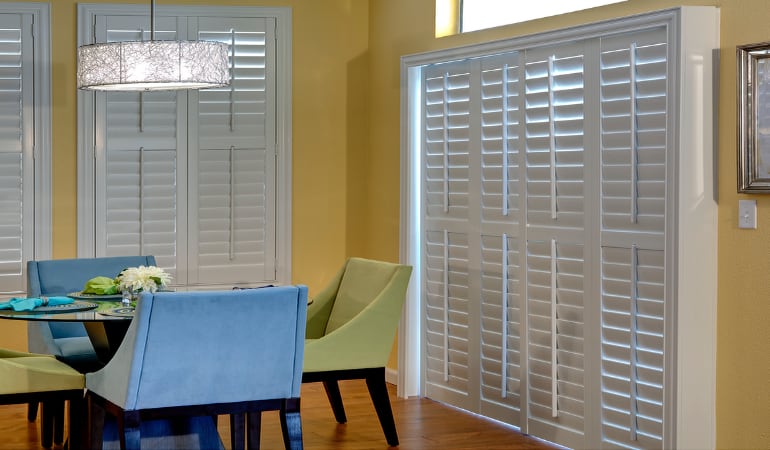 Plantation shutters on a French door work like common window shutters. Patio Doors with Plantation Shutters in Houston