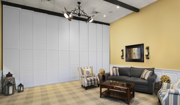 Plantation shutters can be used on as a room divider. Shutters as a room divider for a business