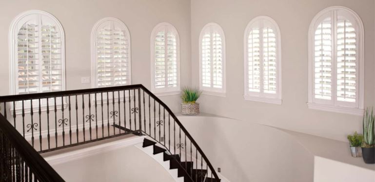 Custom window treatments completely cover your window and smoothly open and close. Arched Plantation Shutters