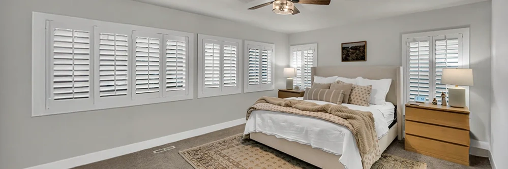 White Polywood shutters on five bedroom windows