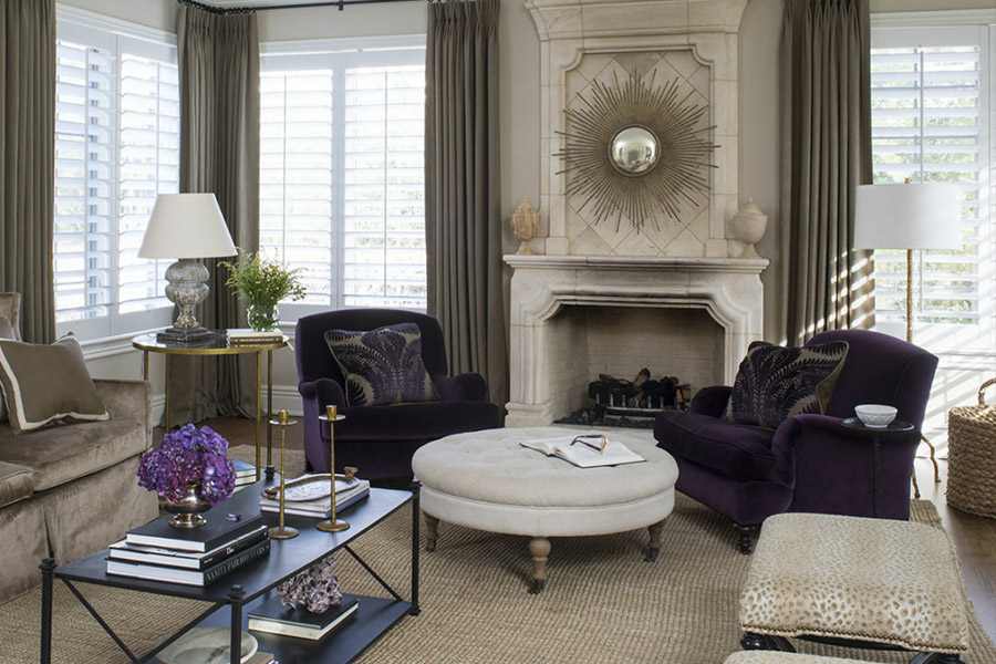 Pair curtains with interior shutters for a luxurious, finished look. Gray curtains and white Polywood shutters on formal living room windows